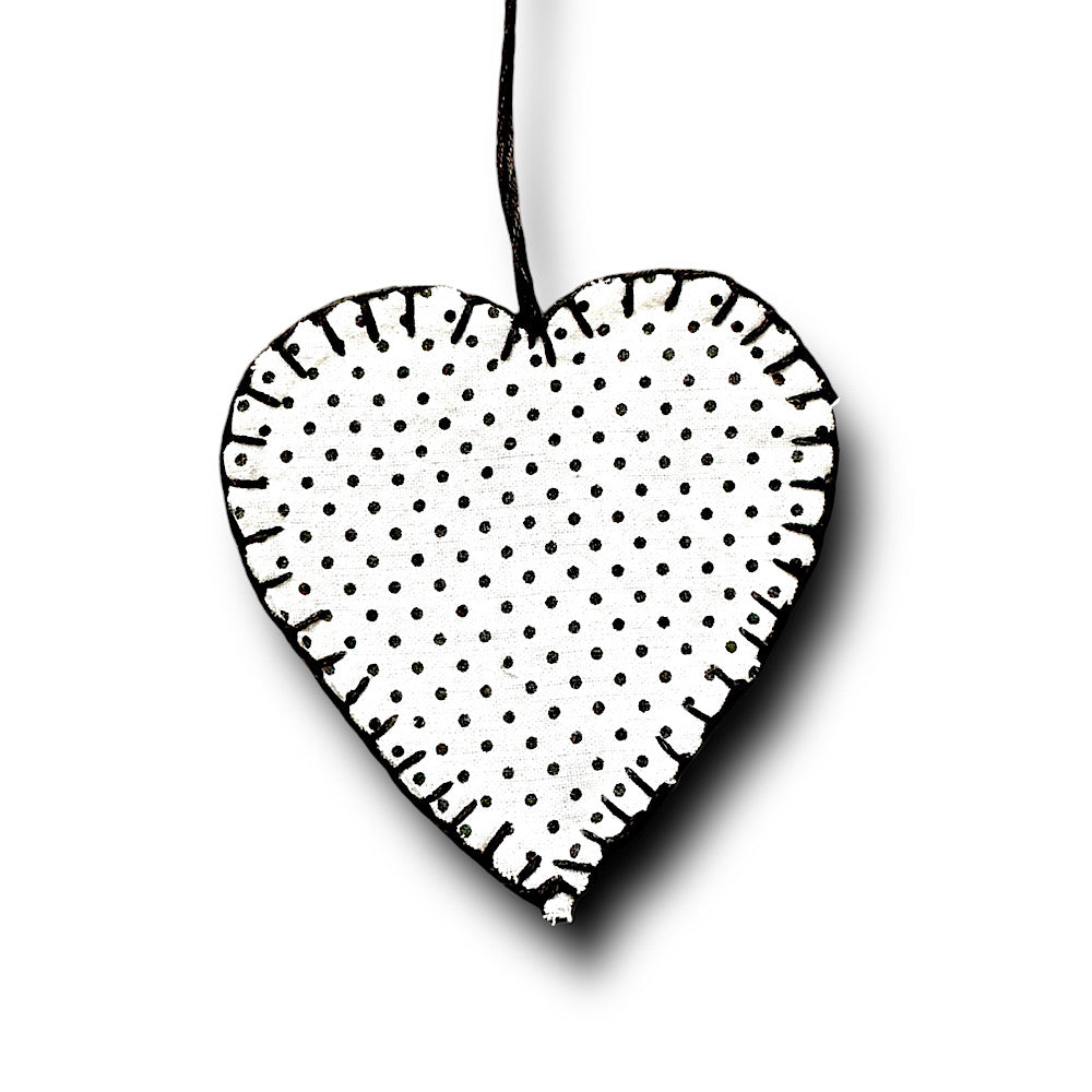 Black and white polka dot hanging heart decoration.