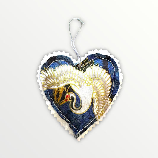 Hanging heart decoration featuring a stork.