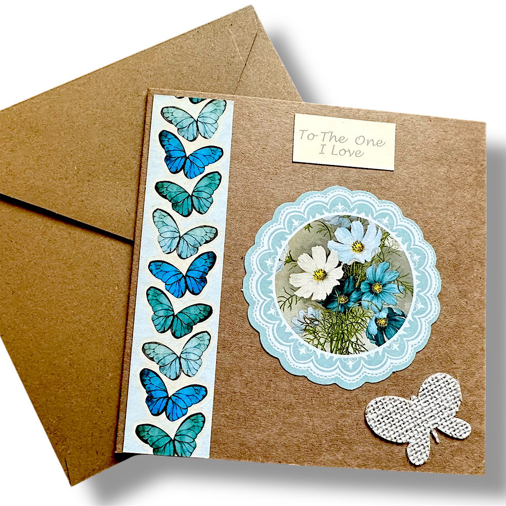 “To the one I love” handmade Valentine’s Day card. Blue butterflies and flowers.