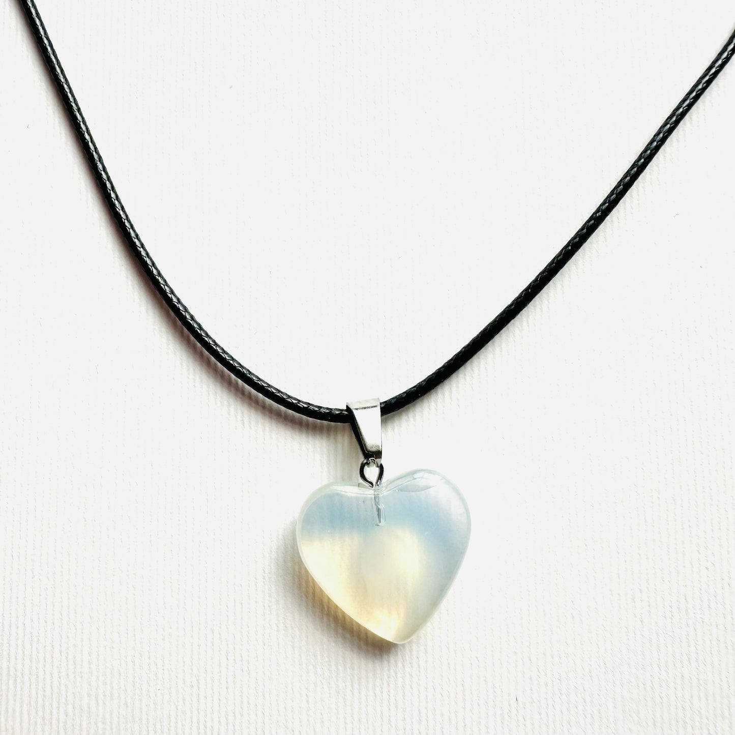Heart necklace ( transparent with milky white parts, natural stone)