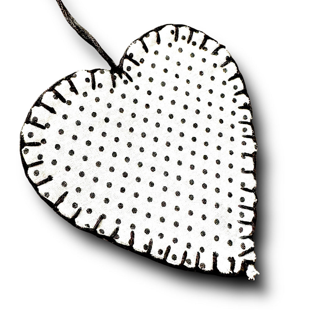 Black and white polka dot hanging heart decoration.