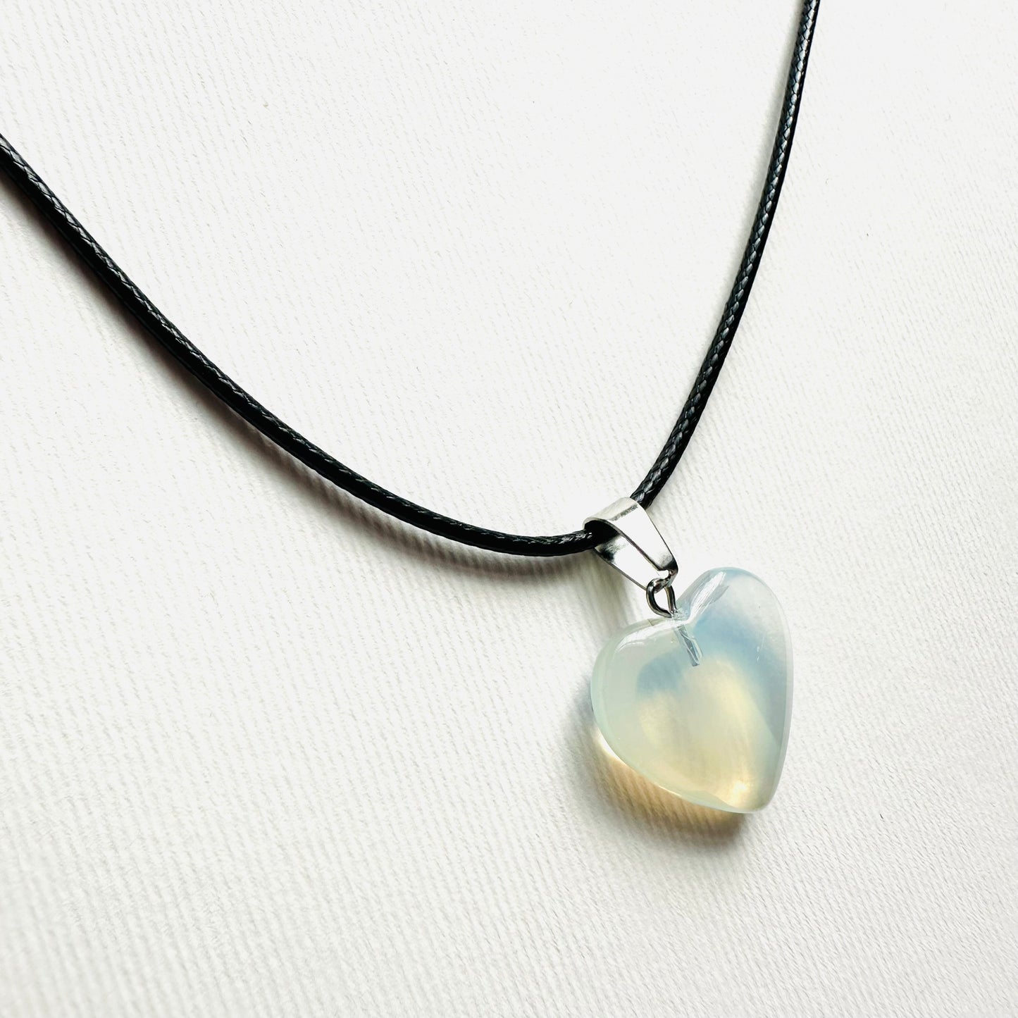 Heart necklace ( transparent with milky white parts, natural stone)