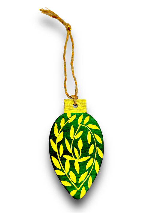 Green and gold wooden Christmas tree decoration.