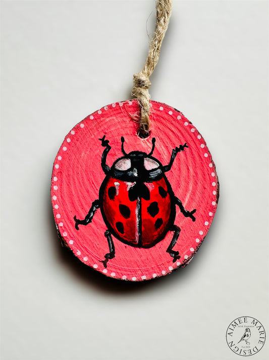 Handmade ladybird wood slice art.