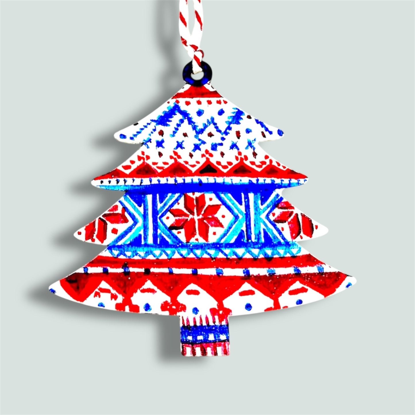 Fairisle style wooden Christmas tree decoration.
