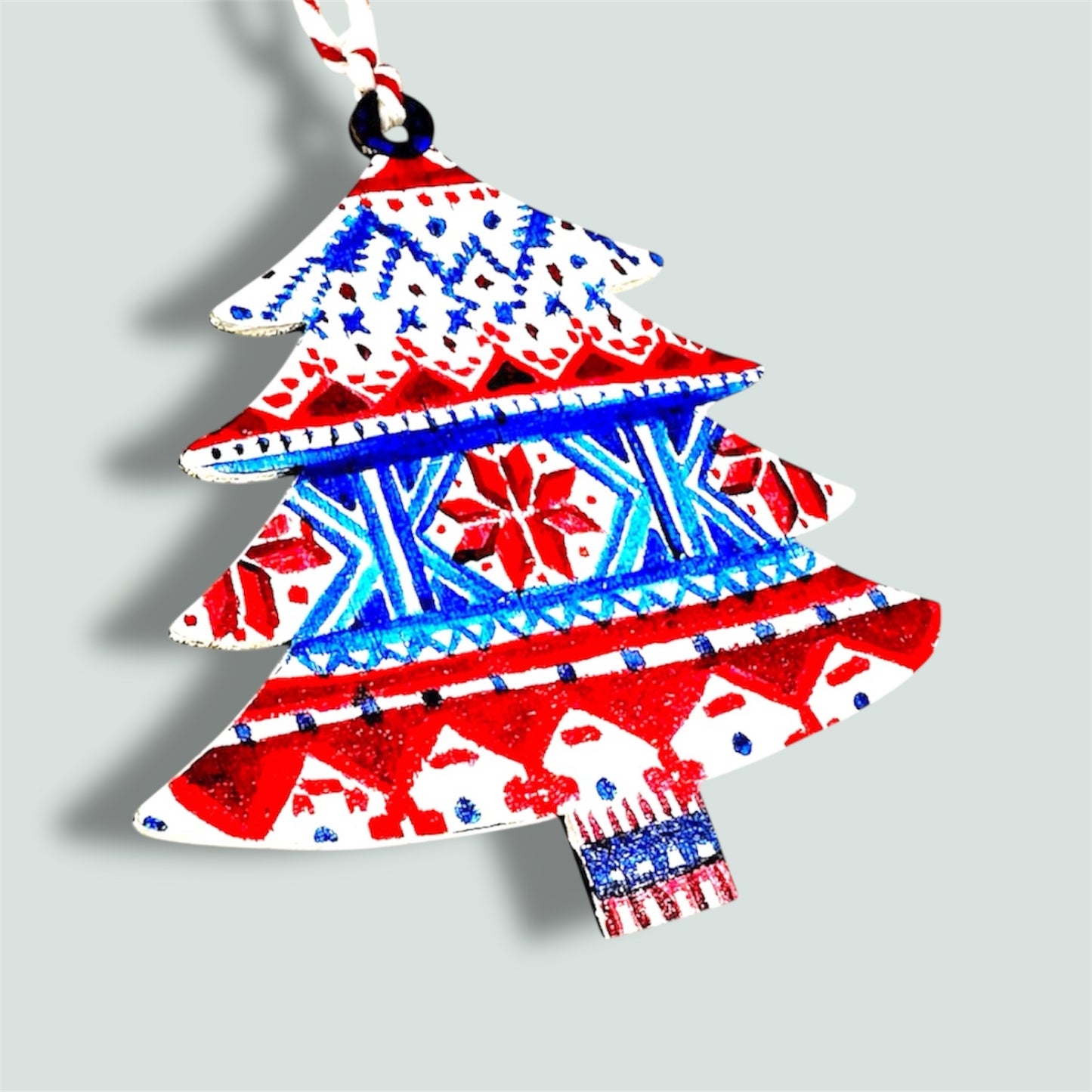 Fairisle style wooden Christmas tree decoration.