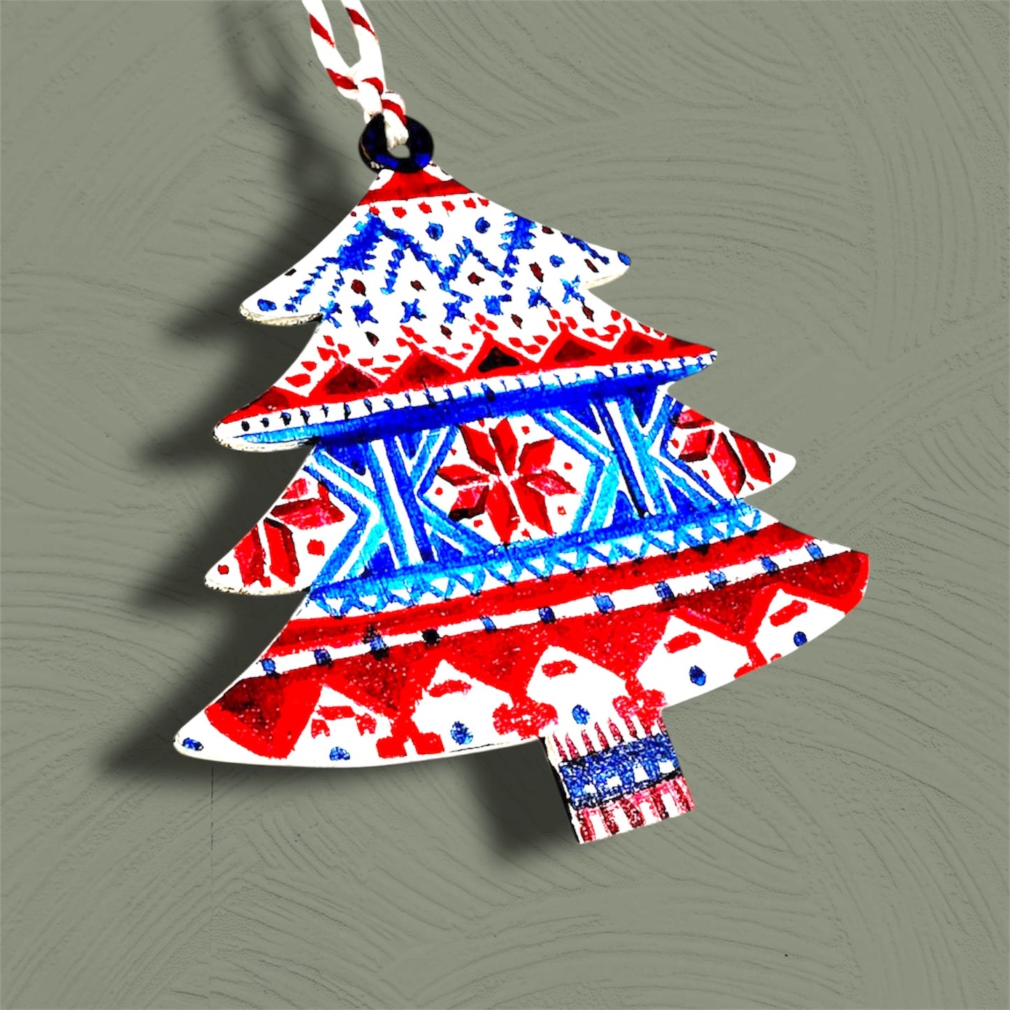 Fairisle style wooden Christmas tree decoration.