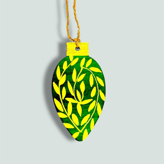 Green and gold wooden Christmas tree decoration.