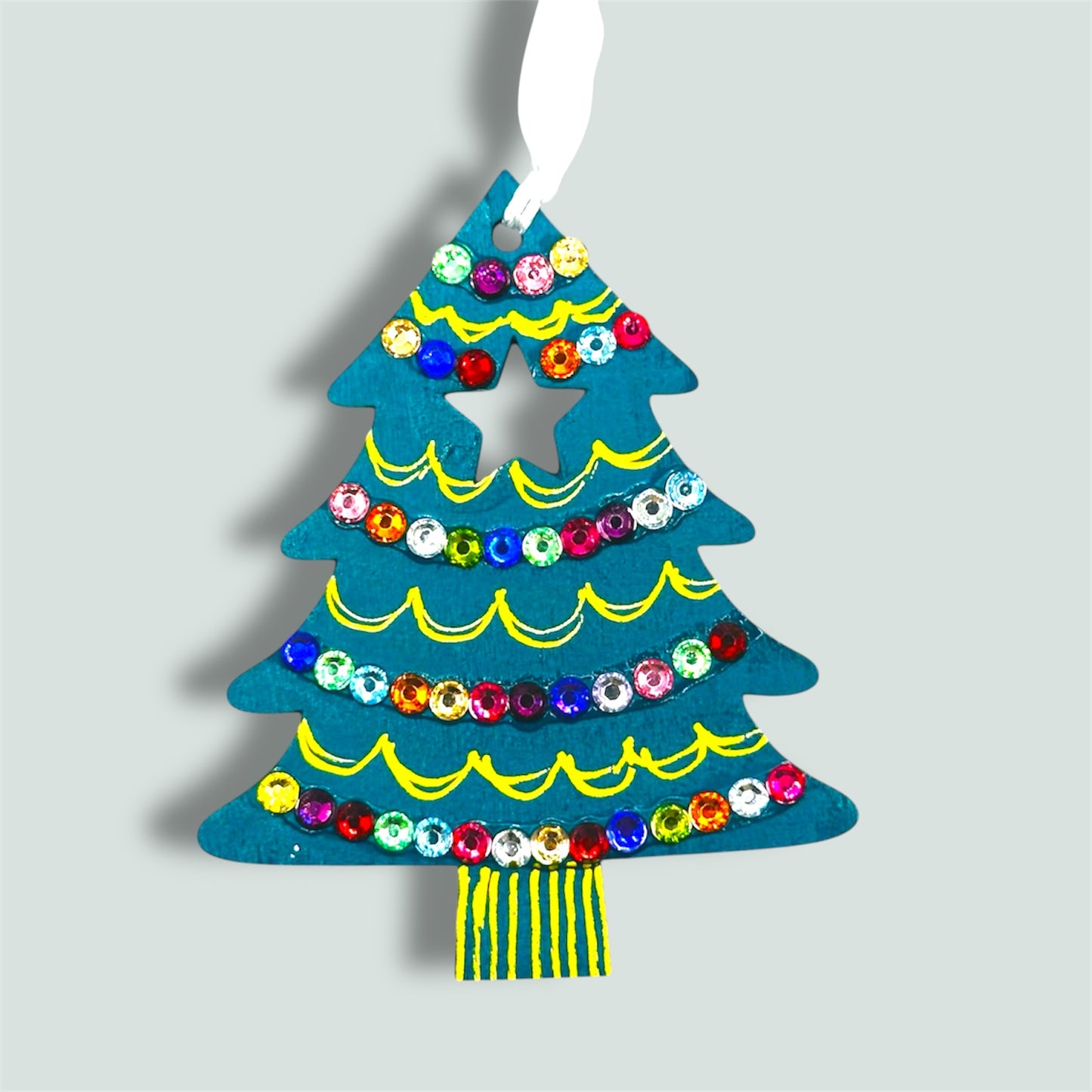 Christmas tree decoration with sparkling gems.
