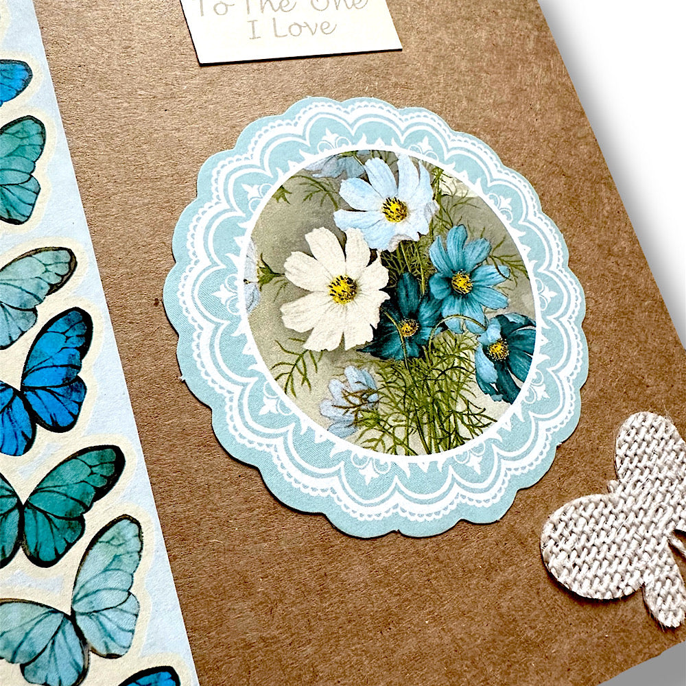 “To the one I love” handmade Valentine’s Day card. Blue butterflies and flowers.